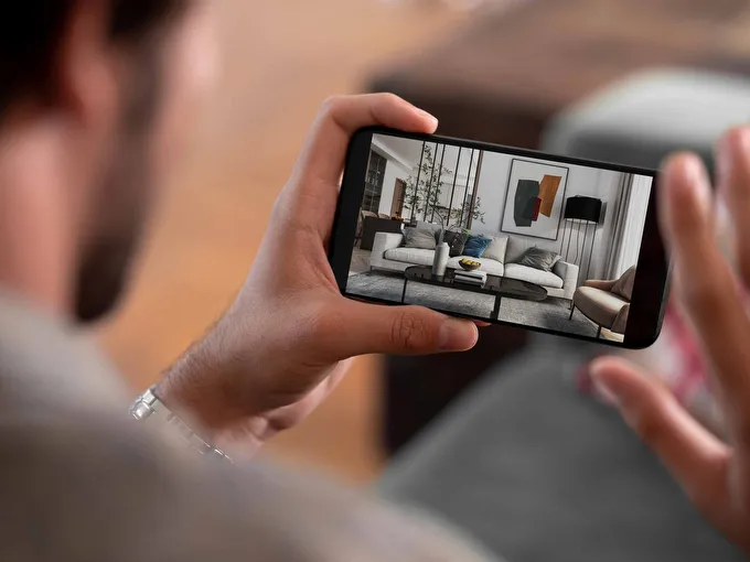 STREIF Innenraum auf Smartphone während einer Beratung mit visualisiertem Wohnzimmer und Sofa